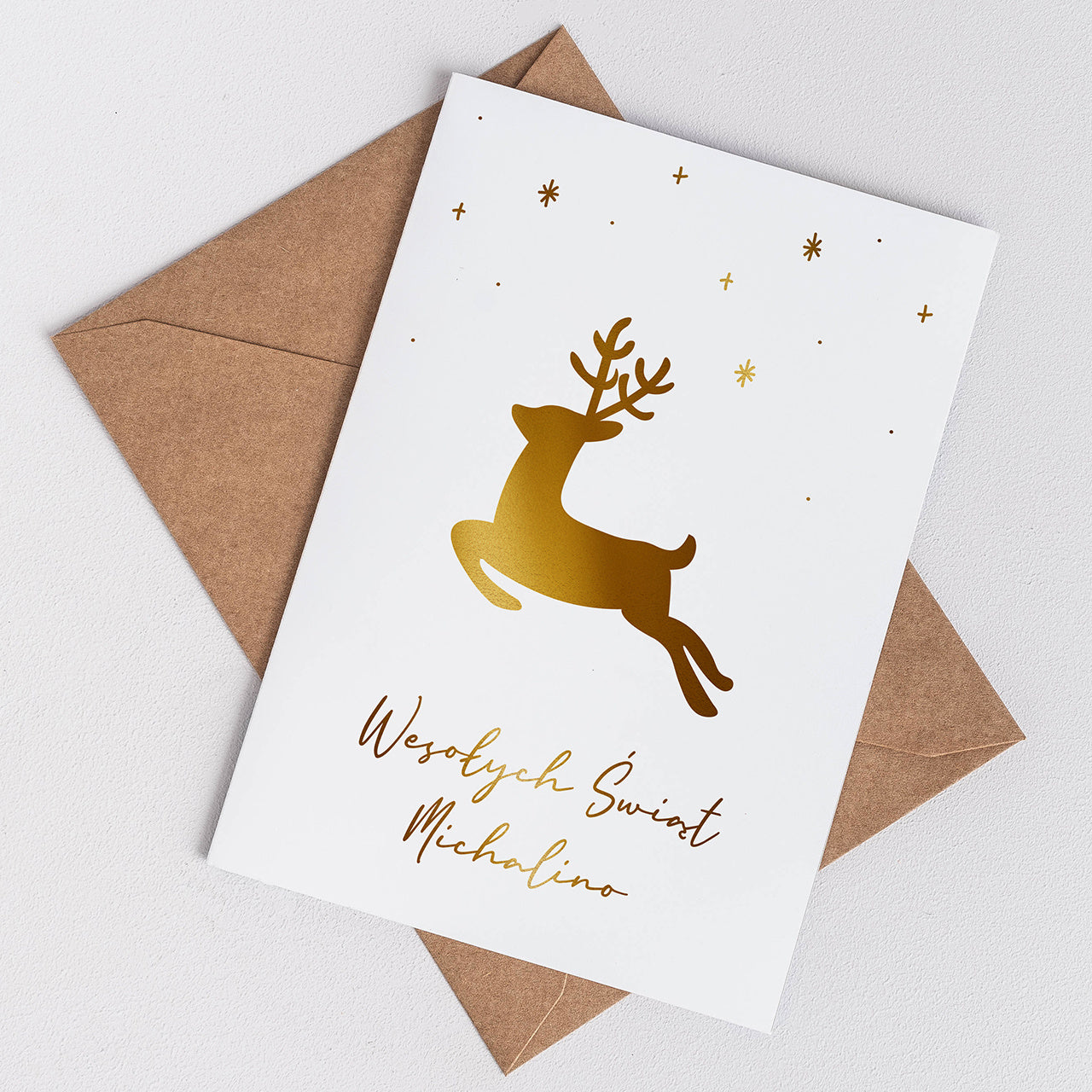Personalizowana kartka świąteczna z reniferem - złoty nadruk
